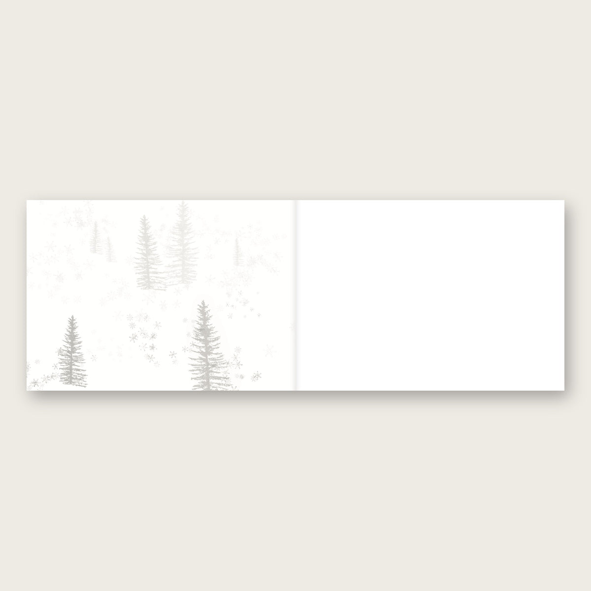 Rolling Hare Christmas, First Edition card by Tim Hupkes, opened: snowy trees on the inside left, blank on the right