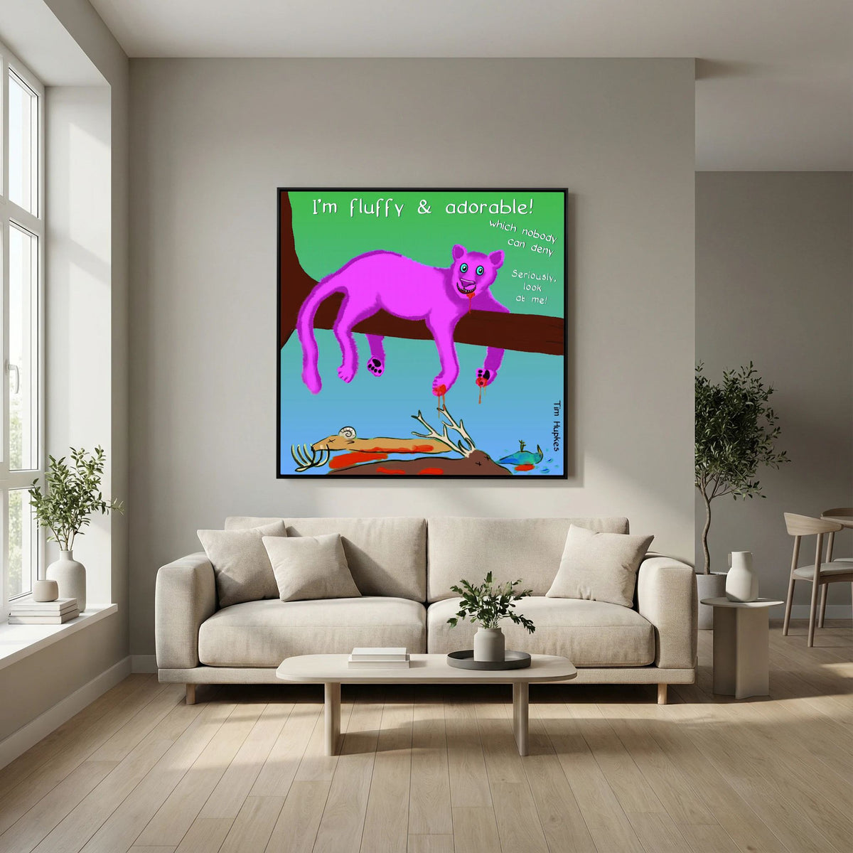 Black-framed Fluffy Pink Panther by Tim Hupkes over a cream sofa and coffee table in a light, open living room