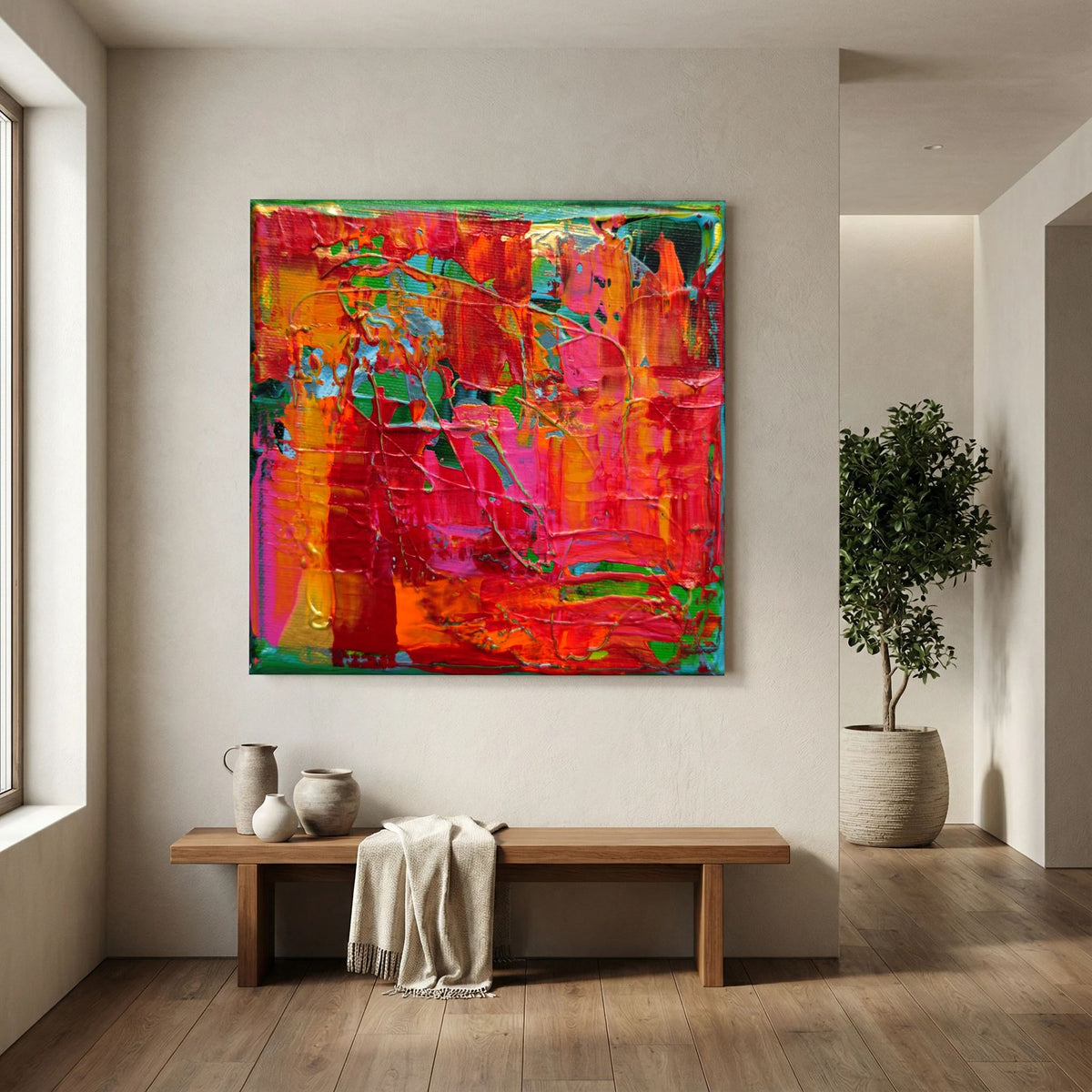 Having Fun van Tim Hupkes zonder lijst, abstract werk in rood en oranje boven een houten bankje in een lichte hal