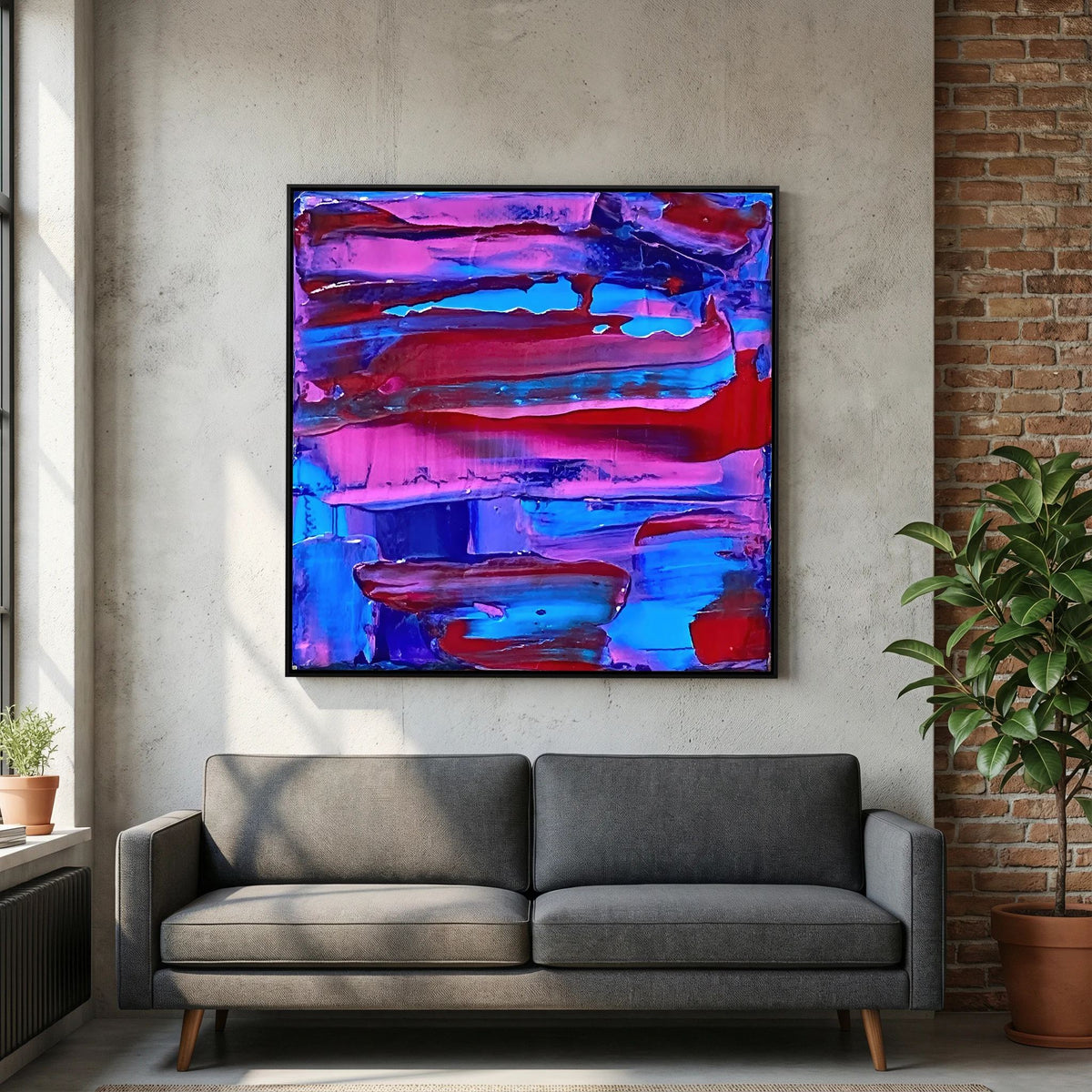 Sunset Overflow van Tim Hupkes in een zwarte lijst boven een grijze bank in een loftwoonkamer met een bakstenen muur