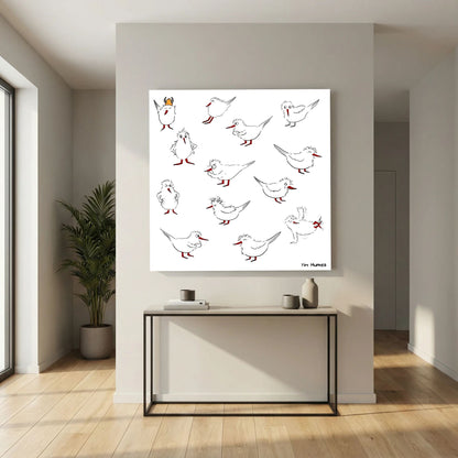 Unframed Blackburn & Haptoe - everyday heroes by Tim Hupkes canvas print above a slim console table in a hallway with a potted plant