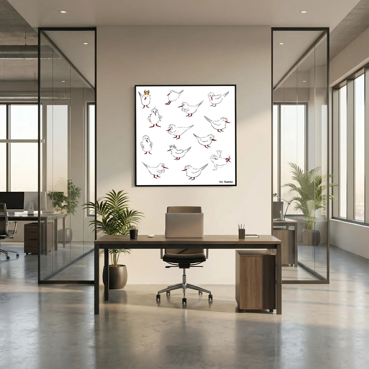Black-framed Blackburn & Haptoe - everyday heroes by Tim Hupkes behind a desk and office chair in an open-plan glass-walled office