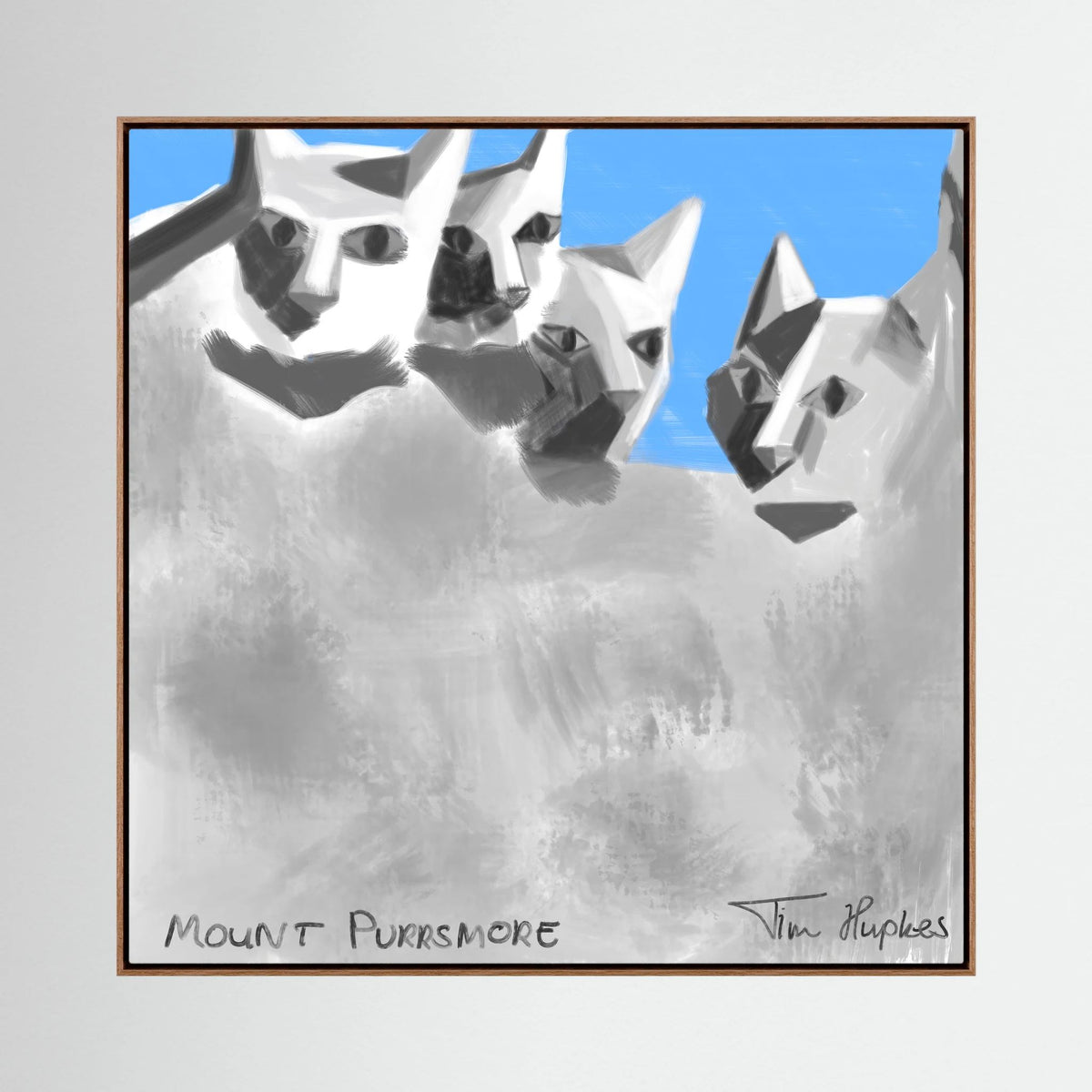 Mount Purrsmore by Tim Hupkes canvas print in a natural oak frame, with four faceted cat faces on a grey mountain and blue sky behind