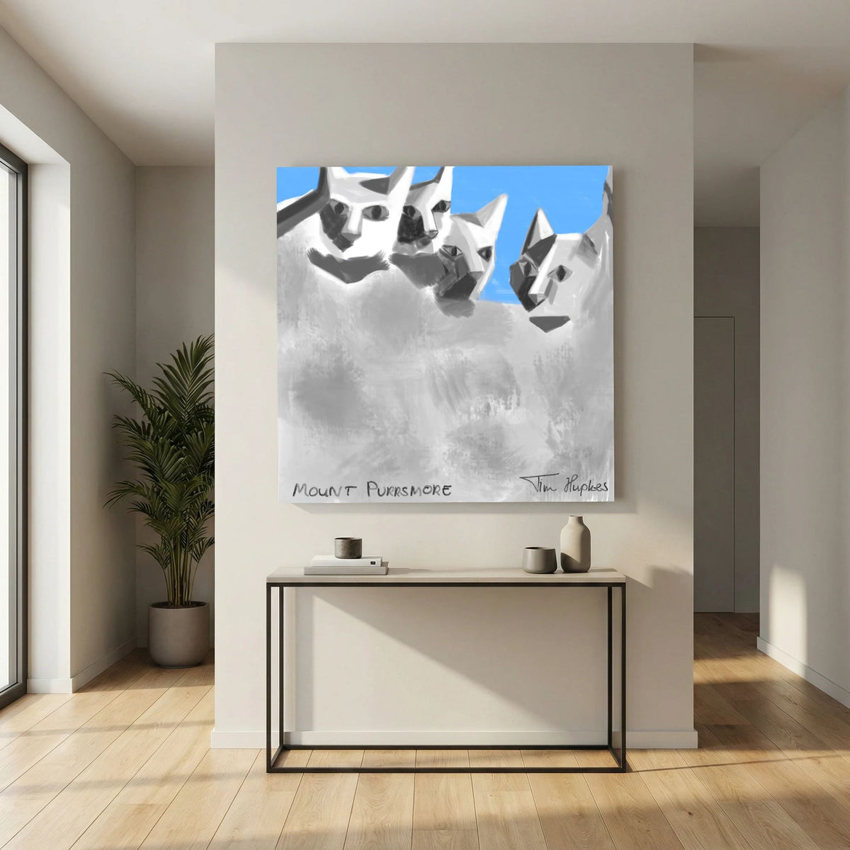 Unframed Mount Purrsmore by Tim Hupkes canvas print on a white wall above a slim console table with vases, near a tall potted plant