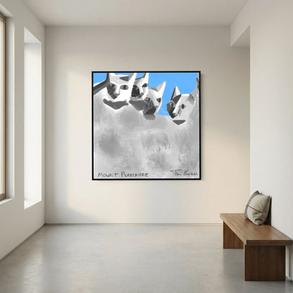 Black-framed Mount Purrsmore by Tim Hupkes canvas print on a white wall in a bright, empty room with a wooden bench and cushion