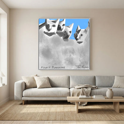 White-framed Mount Purrsmore by Tim Hupkes canvas print above a light sofa with cushions, a low wooden coffee table and a jute rug