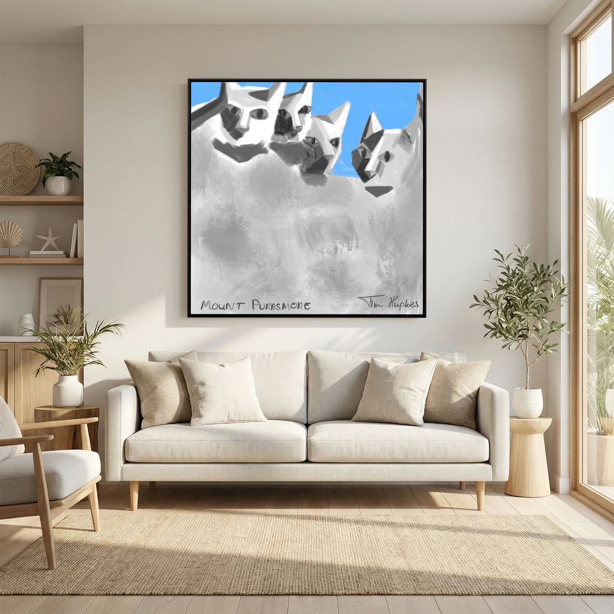 Mount Purrsmore by Tim Hupkes canvas print in a black frame above a white sofa with cushions, near a sunny window and a plant