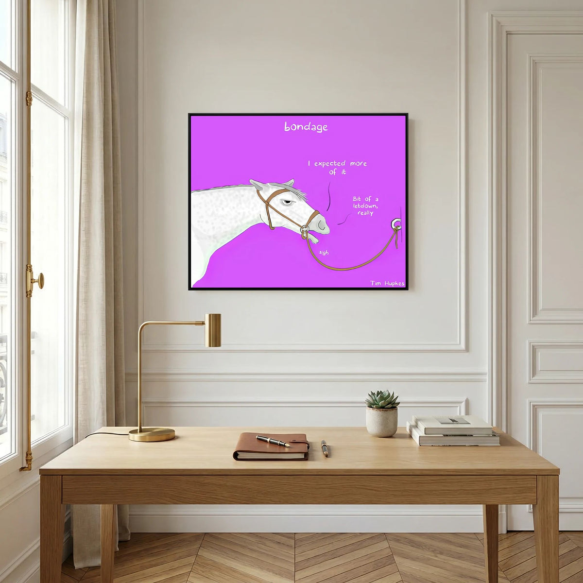 Bondage canvas print in a black frame above a light wooden desk in a panelled study