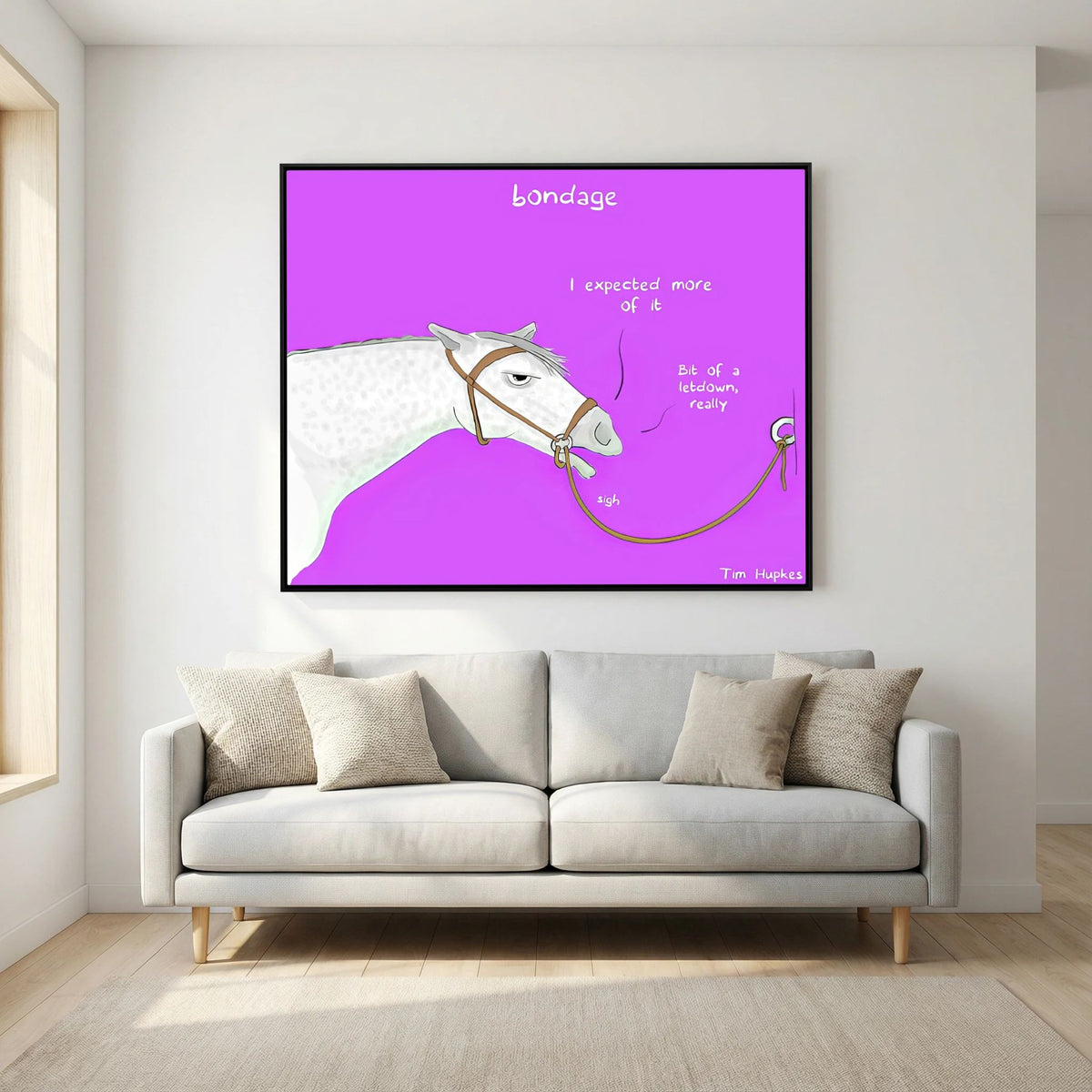 Bondage canvas print in a black frame above a light grey sofa in a living room